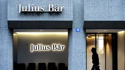 A pedestrian passes a Julius Baer branch in Zurich, Switzerland. Adrian Moser / Bloomberg