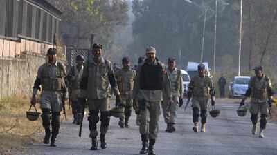 Pakistani paramilitary soldiers arrive at a special court formed to try former president Pervez Musharraf for treason in Islamabad. Faisal Mahmood / Reuters