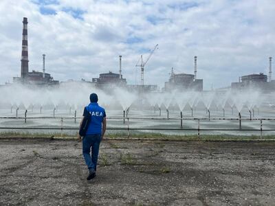 A member of the IAEA walks near the Zaporizhzhia Nuclear Power Plant in Enerhodar, Ukraine. AFP