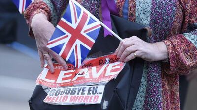 A vote leave supporter with a poster in London on June 24, 2016. Toby Melville/ Reuters