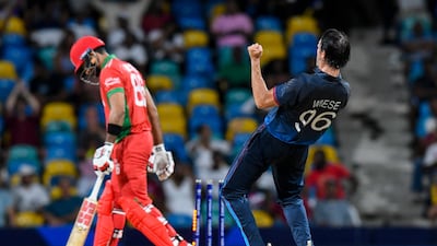 Oman's Naseem Khushi (L) is bowled by Namibia's David Wiese in the super over during the ICC men's Twenty20 World Cup 2024 group B cricket match between Namibia and Oman at Kensington Oval, in Bridgetown, Barbados on June 2, 2024. (Photo by Randy Brooks / AFP)