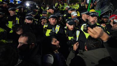 Protesters confront police outside a Kurdish community centre in London after it was raided by counter-terror officers. Getty Images