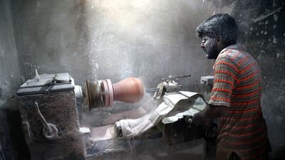 A labourer works at a factory that produces handicrafts made of salt in Karachi, Pakistan. EPA