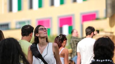 Passersby check out the damage caused by the blaze.
