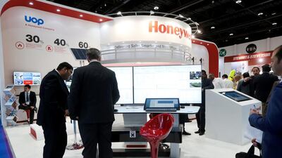 Delegates at the Honeywell display at Adipec 2015. Christopher Pike / The National