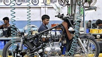 Workers assemble a Royal Enfield motorcycle inside its factory in the southern Indian city of Chennai. Reuters