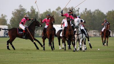 Polo exhibition match between Abu Dhabi Commercial Bank (pink) and St Regis (white) during last year’s Pink Polo event to raise awareness about breast cancer. Pawan Singh / The National