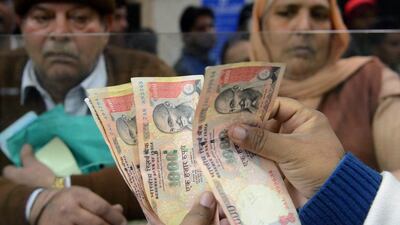 Families of Indian expatriates in the country have been unable to withdraw remittances one month after the government withdrew 500 and 1,000 rupee notes from circulation. Narinder Nanu / AFP