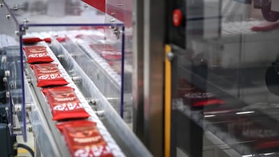 Packaged KitKats make their way to the loading area to be boxed up.