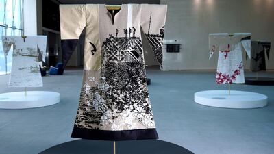 In the 'Leap of Faith' thobe, boys jump from the famous cliffs of Akka to prove their manhood. In this thobe we see one young man suspended in mid-air, a splash beneath showing another boy has taken the plunge just before him. Layer upon layer of intricate tatreez have been woven to capture the jagged rocks, giving this thobe a beautiful texture. Victor Besa/The National