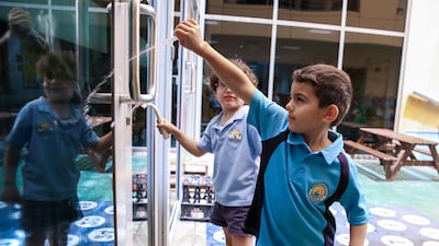 Pupils on window-cleaning duty.