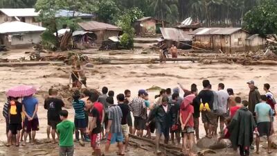 People help rescue flood victims in Lanao Del Norte, Philippines, December 22, 2017 in this image taken from video footage obtained from social media. Climah Cabugatan Disumala / Reuters