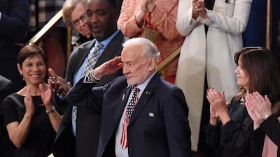 Former NASA astronaut Buzz Aldrin salutes as he is recognised by US President Donald Trump. AFP