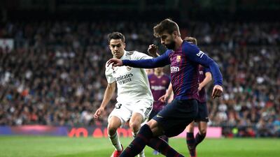 Sergio Reguilon of Real Madrid closes down Gerard Pique of Barcelona. Getty