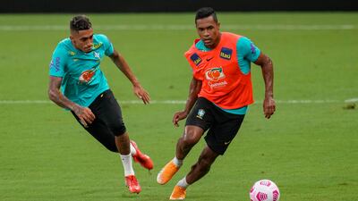 Brazil's Alex Sandro, right, and Raphinha practice during a training session in Manaus. AP Photo