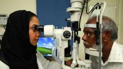 Dr Manal Taryam of the National Committee for the Prevention of Blindness examines Yousef Sulaiman at Rashid Hospital, Dubai.