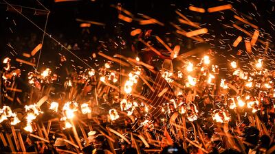Participants take part in the Up Helly Aa festival parade through the streets of Lerwick, Shetland Islands on January 31, 2023. - Up Helly Aa celebrates the influence of the Scandinavian Vikings in the Shetland Islands and culminates with up to 1,000 'guizers' (men in costume) throwing flaming torches into their Viking longboat and setting it alight later in the evening. (Photo by Andy Buchanan / AFP)