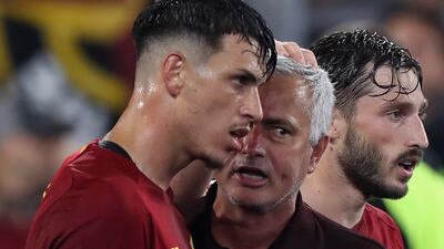 Roger Ibanez with Jose Mourinho after the late winner. Getty