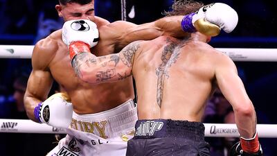 Jake Paul lands a left jab on Tommy Fury. AFP