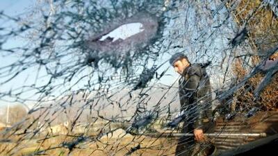 An Indian policeman is seen through a damaged windshield after a shootout in Srinagar last week. Danish Ismail / Reuters