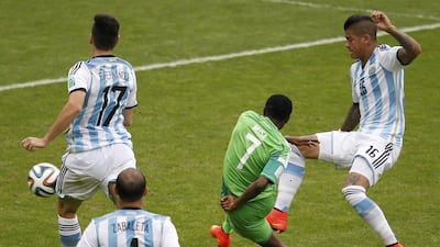 Nigeria's Ahmed Musa shoots and scores his second goal against Argentina to equalise again at 2-2 on Wednesday in their match at the 2014 World Cup. Marko Djurica / Reuters
