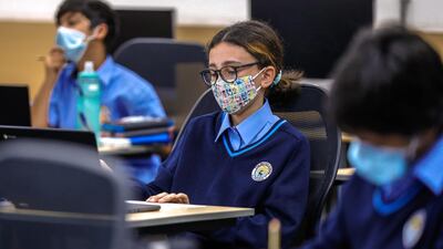 Pupils wear masks during their studies as they settle back into life in the classroom.