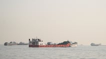 Vessels anchored in the Strait of Hormuz, as seen from Oman. The waterway remains a volatile place for seafarers. Reuters