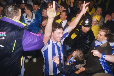 Sheffield Wednesday player David Hirst celebrates with fans after beating Chelsea in the Rumbelows League Cup semi final second leg at Hillsbrough on February 27, 1991 in Sheffield, England. Getty Images