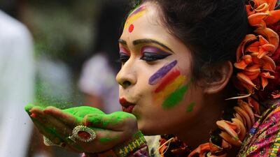 An Indian reveller plays with coloured powder during celebrations for the Holi festival in Siliguri, West Bengal.Diptendu Dutta / AFP Photo