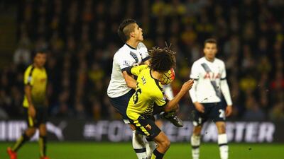 WATFORD, ENGLAND - DECEMBER 28: Nathan Ake of Watford fouls Erik Lamela of Tottenham Hotspur resulting in a red card during the Barclays Premier League match between Watford and Tottenham Hotspur at Vicarage Road on December 28, 2015 in Watford, England. (Photo by Richard Heathcote/Getty Images)
