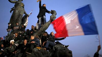 A man holds a giant pencil as he takes part in a solidarity march on January 11, 2015, in the streets of Paris, France. Stephane Mahe / Reuters