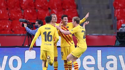 Frenkie de Jong celebrates with teammates Pedri, Antoine Griezmann and Lionel Messi after scoring the second goal. Getty