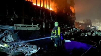 A rescue worker at a shopping mall in Kyiv after a Russian air strike. Reuters