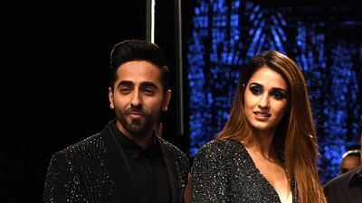 Ayushmann Khurrana and Disha Patani present creations by designers Rohit Gandhi and Rahul Khanna at Lakme Fashion Week. Photo: Sujit Jaiswal / AFP