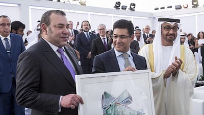Sheikh Mohammed bin Zayed, Crown Prince of Abu Dhabi and Deputy Supreme Commander of the UAE Armed Forces, and King Mohammed VI of Morocco, left, present Dr Marc Harrison, former chief executive of Cleveland Clinic Abu Dhabi, with a painting of the new hospital during the facility’s opening ceremony. Ryan Carter / Crown Prince Court – Abu Dhabi