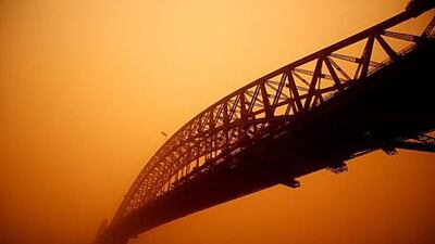 The Sydney Harbour Bridge today. Severe wind storms in the west of New South Wales have blown a dust cloud that has engulfed Sydney and surrounding areas.
