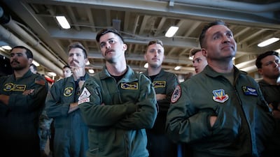 HSC-23 Navy flight crew members watch as the Orion capsule floats in the well deck after being successfully secured off the coast of Baja California, Mexico. EPA