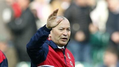 England coach Eddie Jones waves as he watches the warmup before the Six Nations international rugby match between England and Wales at Twickenham stadium in London, Saturday, March,12, 2016. (AP Photo/Alastair Grant)
