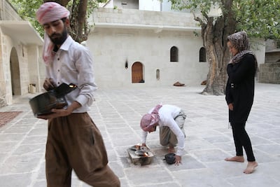 Ashwaq Haji visits the Yazidi temple in Lalish, northern Iraq, where she lives after fleeing Germany. AFP