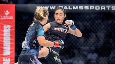 Weronika Zygmunt and Seo Ye-dam during their strawweight bout. Victor Besa/The National