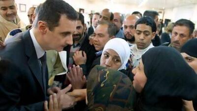 Syrian president Bashar Assad makes a surprise visit to the Educational Centre for Fine Arts in Damascus where families of students martyred as a result of terrorist acts were honoured yesterday.