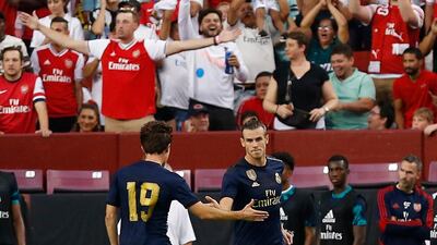 Real Madrid forward Gareth Bale celebrates with Real Madrid defender Alvaro Odriozola after scoring a goal against Arsenal. Reuters