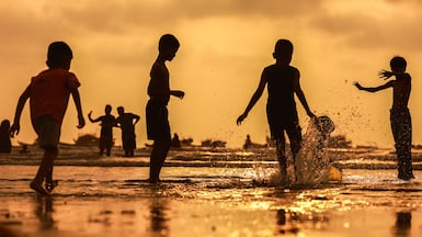 Children cool off at Gorai Beach in Mumbai, India, where a weather warning is in place due to a heatwave. EPA