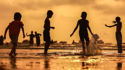 Children cool off at Gorai Beach in Mumbai, India, where a weather warning is in place due to a heatwave. EPA