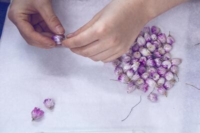 Flowers are attached at the Goossens atelier. Courtesy Anne Combaz