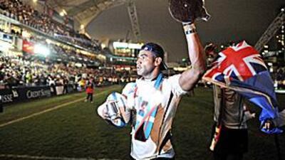 Fiji's Seremaia Burotu celebrates winning the Hong Kong Sevens on Sunday. His former coach, Waisale Serevi, is backing the campaign to reinstate the event in the Olympics, starting in 2016.