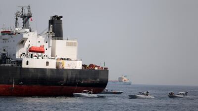 UAE Navy boats are seen next to the Saudi tanker Al Marzoqah off the Port of Fujairah, UAE, May 13, 2019. Reuters