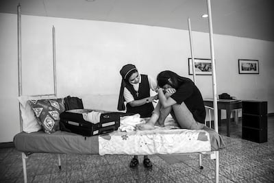 A Catholic nun comforts a trafficking victim in the Philippines. The photograph is part of a recent project by Lisa Kristine, a series that documents the work of Talitha Kum, an anti-trafficking organisation. Lisa Kristine