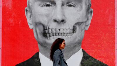 A Romanian woman passes by an image of Russian President Vladimir Putin, part of an anti-war art exhibition, in King's Square, near the Russian Federation's embassy compound, in Bucharest, Romania. EPA