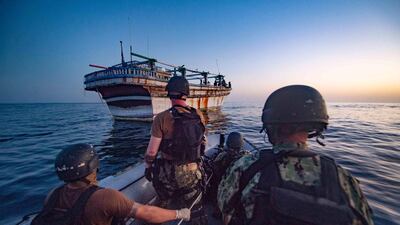 Crew of the destroyer USS Winston S. Churchill (DDG 81), operating under Combined Maritime Forces (CMF), head to provide assistance to an Iranian-flagged motor vessel in distress in the Gulf water off Oman. AFP